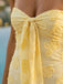 strapless tie front bodice detail butter yellow mini dress structured ruched neckline close up