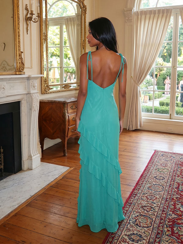 Backless emerald green formal gown with flowing asymmetric chiffon layers
