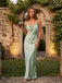 Front view of elegant sage green satin slip maxi dress showcasing the romantic French lace inset bodice, empire waist, and fluid drape along an old European stone pergola pathway.